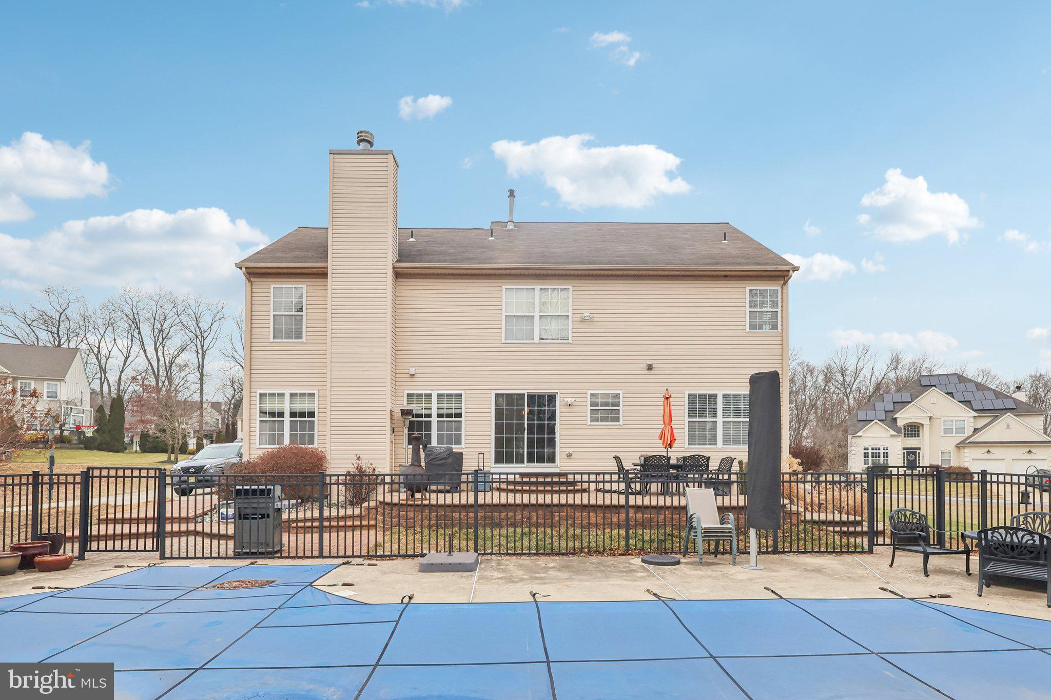 17 Ridgeview Road Delran, NJ 08075 - Photo 37 of 43 a view of a patio with dining table and chairs with couches and potted plants
