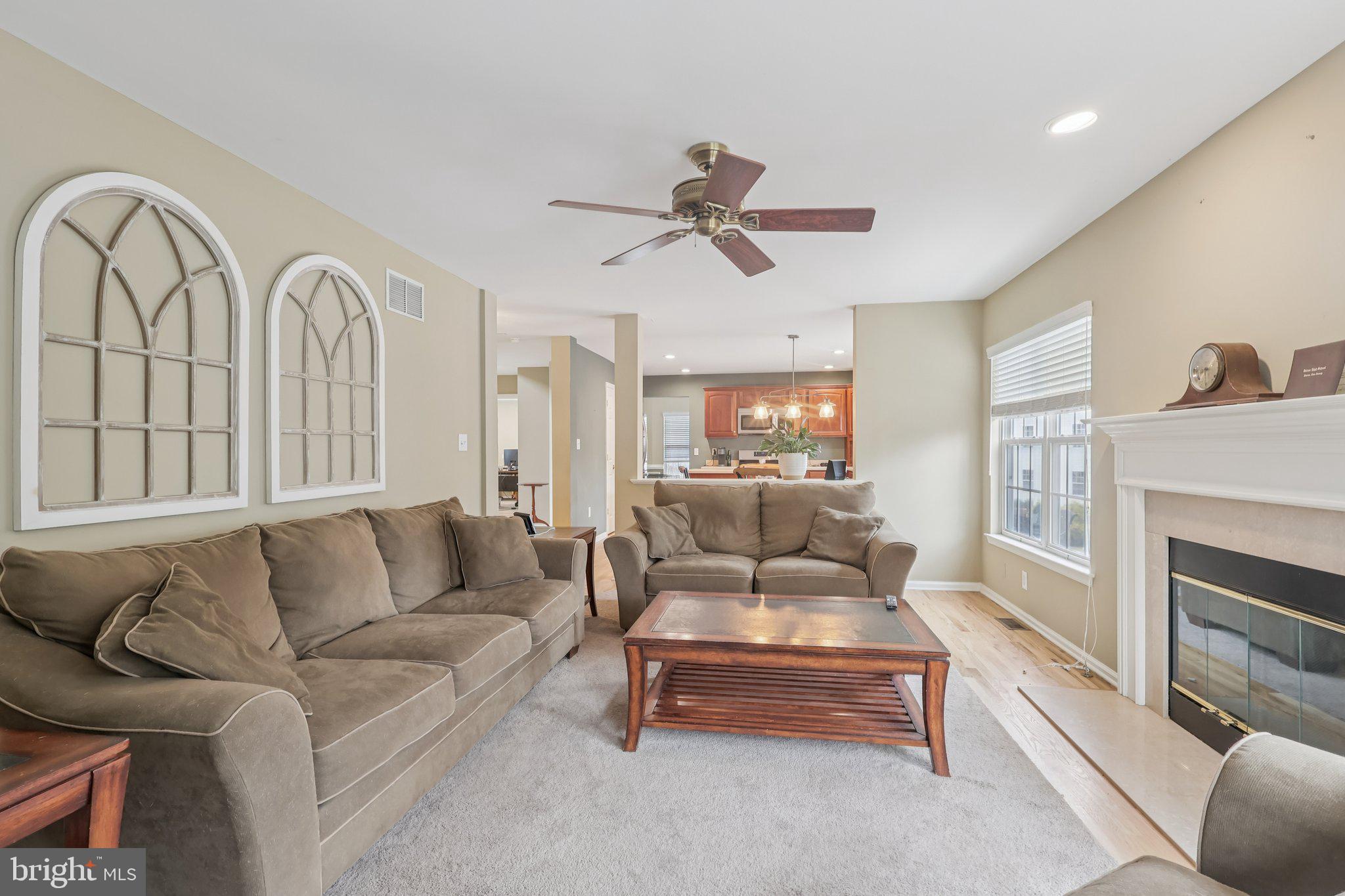 17 Ridgeview Road Delran, NJ 08075 - Photo 6 of 43 a living room with furniture a fireplace and a chandelier