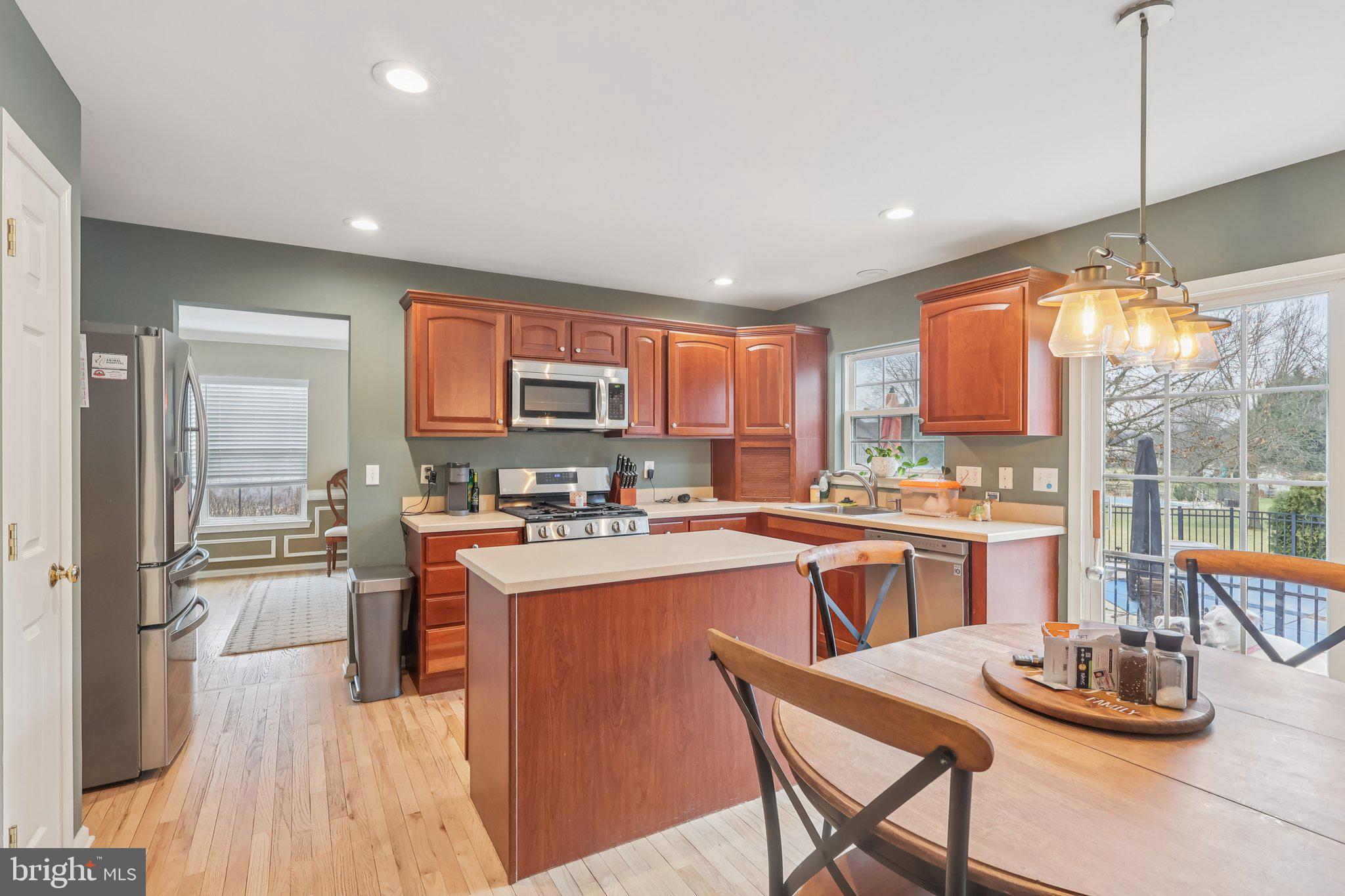 17 Ridgeview Road Delran, NJ 08075 - Photo 10 of 43 a kitchen with a sink a stove a refrigerator cabinets and dining table