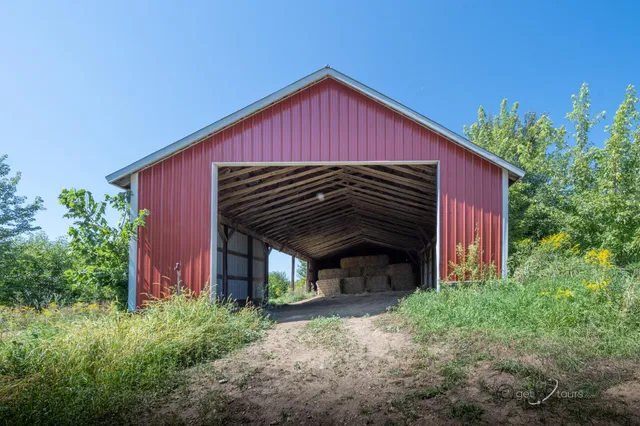 a view of barn with a small yard