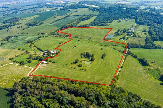 an aerial view of a golf course with parking space