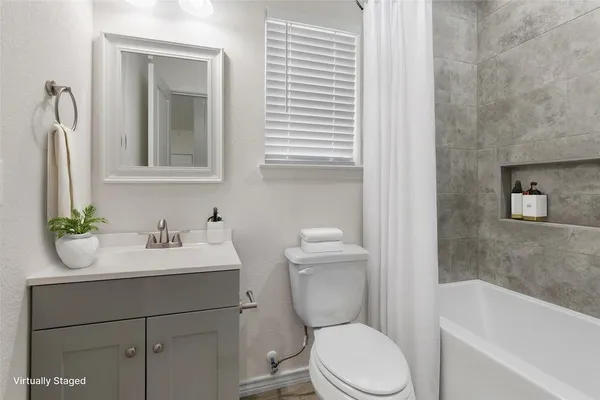a bathroom with a toilet a sink and a bathtub