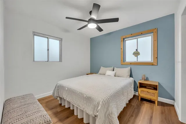 a bedroom with a bed and a table in it