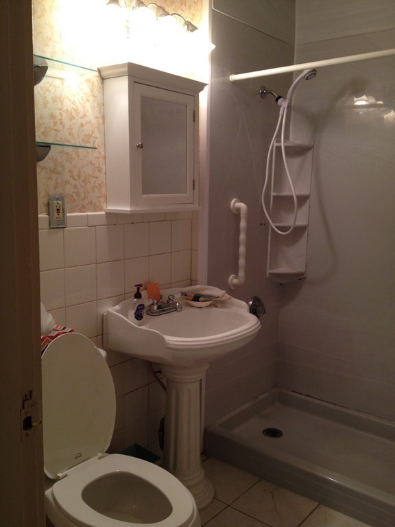 64 Roy Street Springfield, MA 01104 - Photo 14 of 29 a bathroom with a sink toilet and shower
