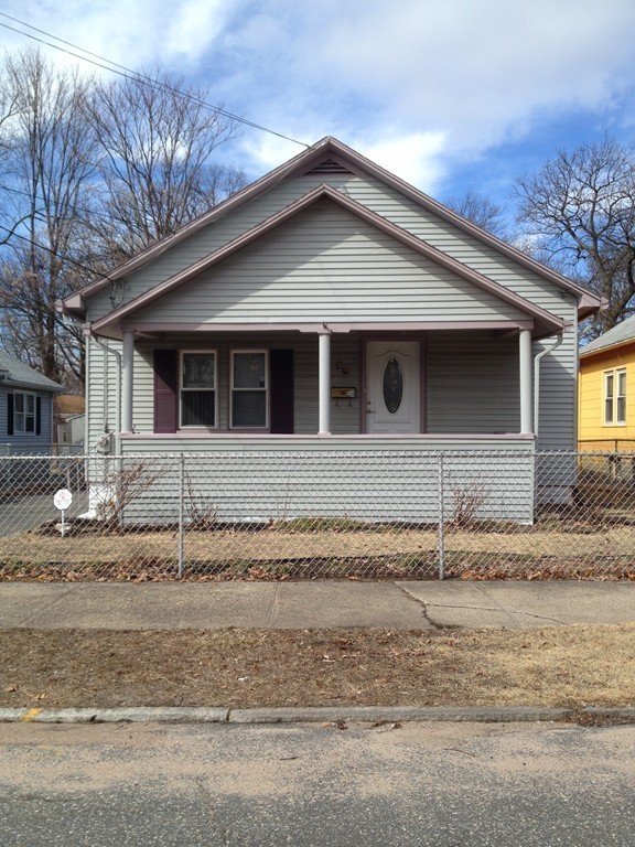 64 Roy Street Springfield, MA 01104 - Photo 2 of 29 a front view of a house with a garden