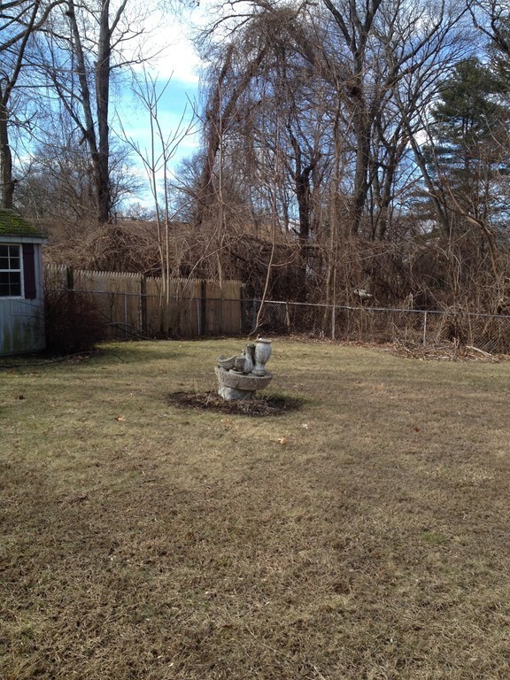 64 Roy Street Springfield, MA 01104 - Photo 28 of 29 a backyard of a house with lots of green space