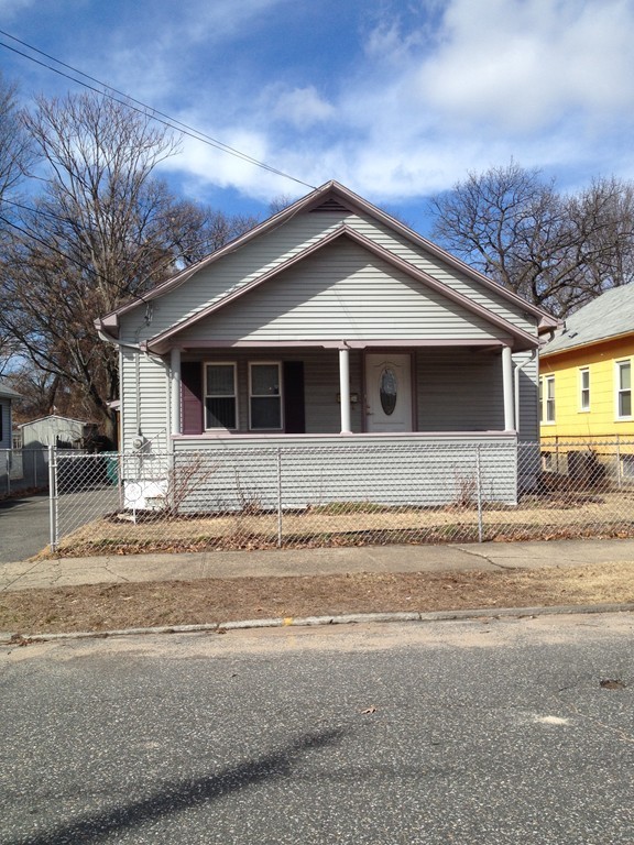 64 Roy Street Springfield, MA 01104 - Photo 3 of 29 a front view of a house with a garden