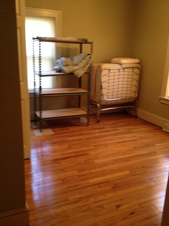 64 Roy Street Springfield, MA 01104 - Photo 7 of 29 a view of room with wooden floor