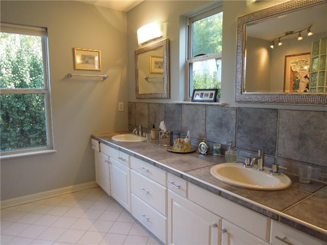 5923 Pettus Road Antioch, TN 37013 - Photo 12 of 20 Master bath with 10' dbl vanity. Tile counter and tile floors. Nice windows. Walk-in closet and dressing area.