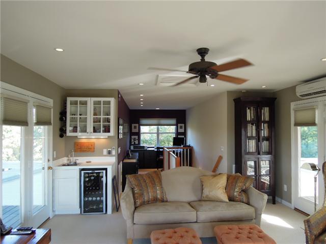 5923 Pettus Road Antioch, TN 37013 - Photo 14 of 20 Upper level bonus with office nook in the back. Ceiling fan. Three doors to surrounding covered deck. Wet bar and space for wine cooler. Wool carpets.