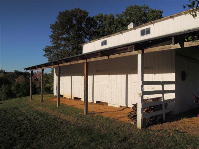 5923 Pettus Road Antioch, TN 37013 - Photo 20 of 20 Horse barn with 4 open stalls, 2 closed stalls, tack room, hay loft, sliding stall doors...heavy construction. Horses or not, this barn is useful!
