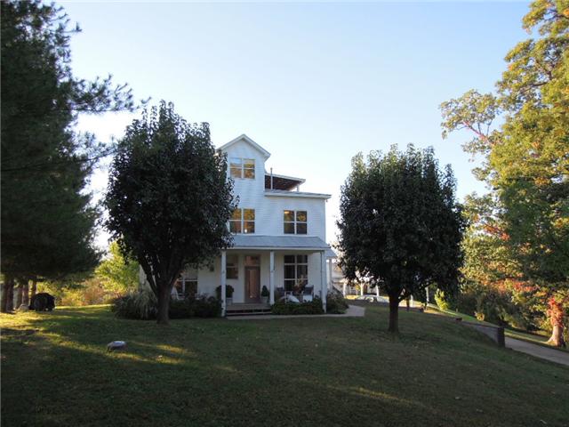 5923 Pettus Road Antioch, TN 37013 - Photo 5 of 20 Surrounded by green and the painted trees of fall. What a find! Three newer HVAC systems. New 50 gal water heater. Hooked up to natural gas now but propane tank is buried in yard and the systems can be converted back to propane.