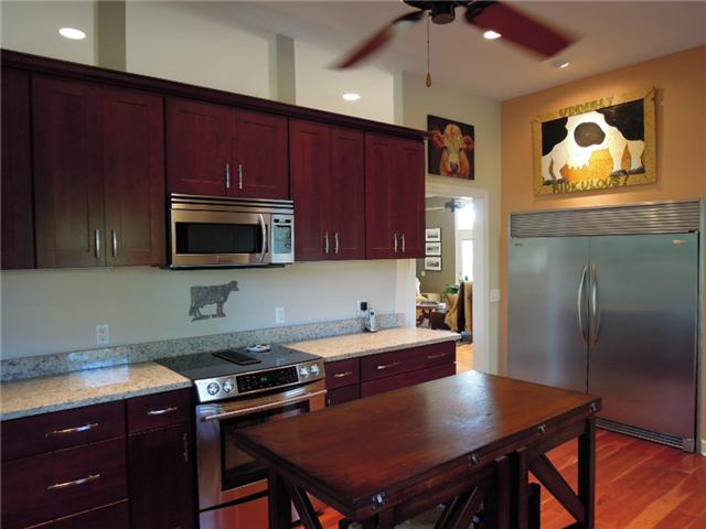 5923 Pettus Road Antioch, TN 37013 - Photo 6 of 20 Fabulous kitchen with 42" cabinets, granite, high ceilings! Upgraded appliances including JennAire SS drop in stove with downdraft exhaust and SS microwave.