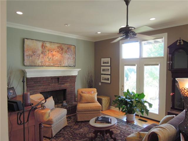 5923 Pettus Road Antioch, TN 37013 - Photo 7 of 20 Main level has9' ceilings and fireplace in the great room. Hardwood flooring from entry through kitchen, LR, and DR. Doors to deck invite the light and open to gorgeous views! No neighbors up close. Additional two acres can be had for $50k.