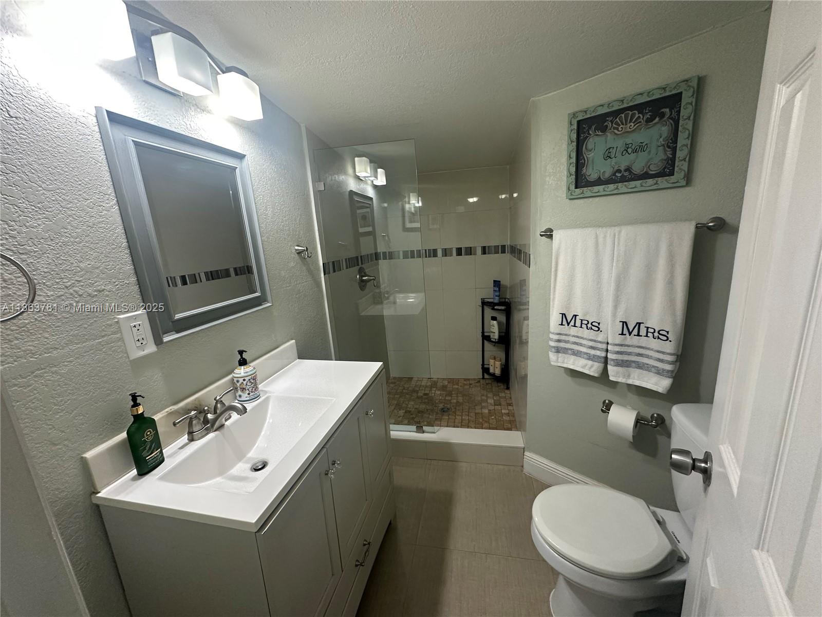 7310 Southwest 31st Street Miami, FL 33155 - Photo 12 of 25 a bathroom with a sink toilet and shower