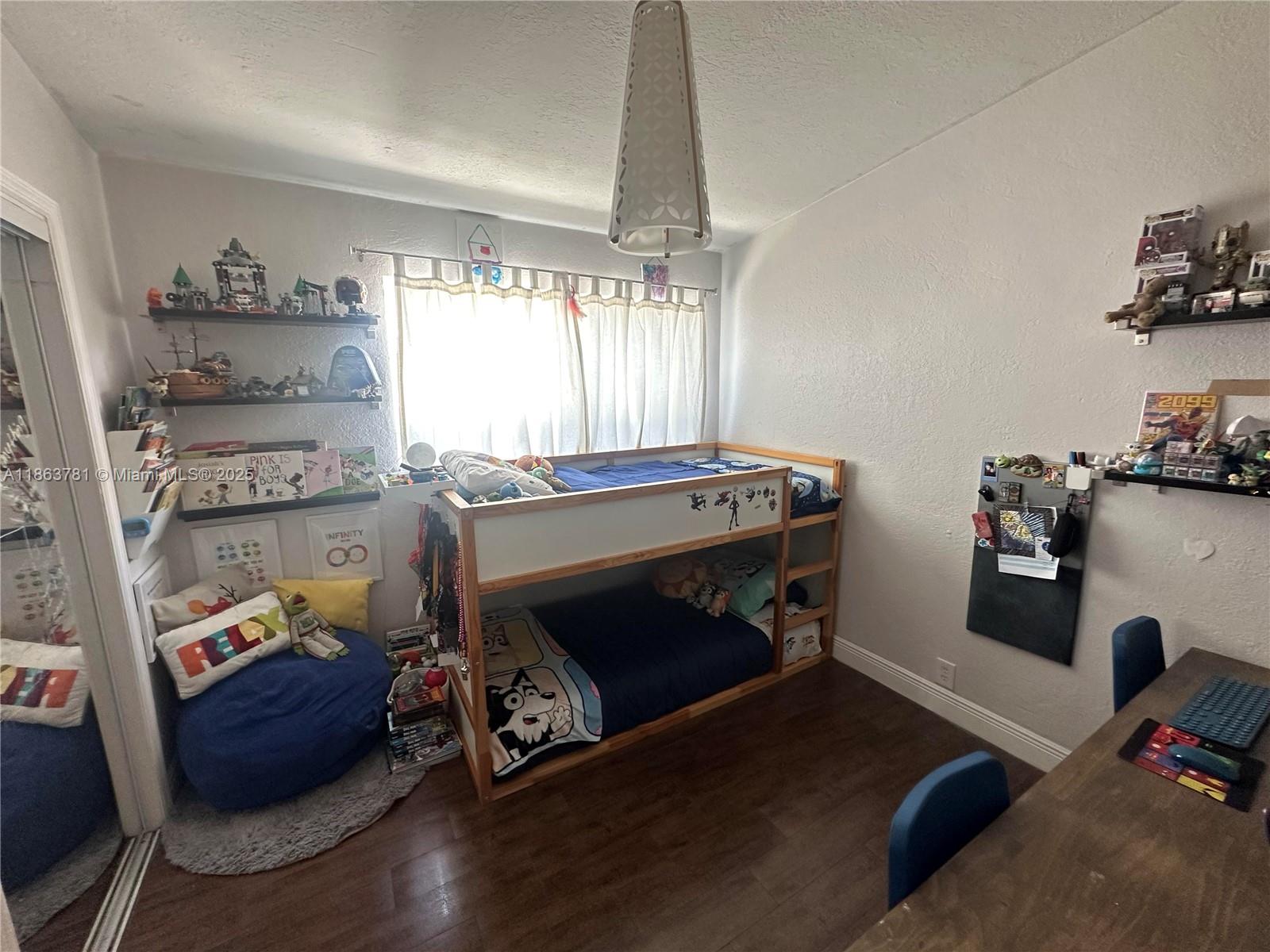 7310 Southwest 31st Street Miami, FL 33155 - Photo 13 of 25 a room with furniture and a wooden floor