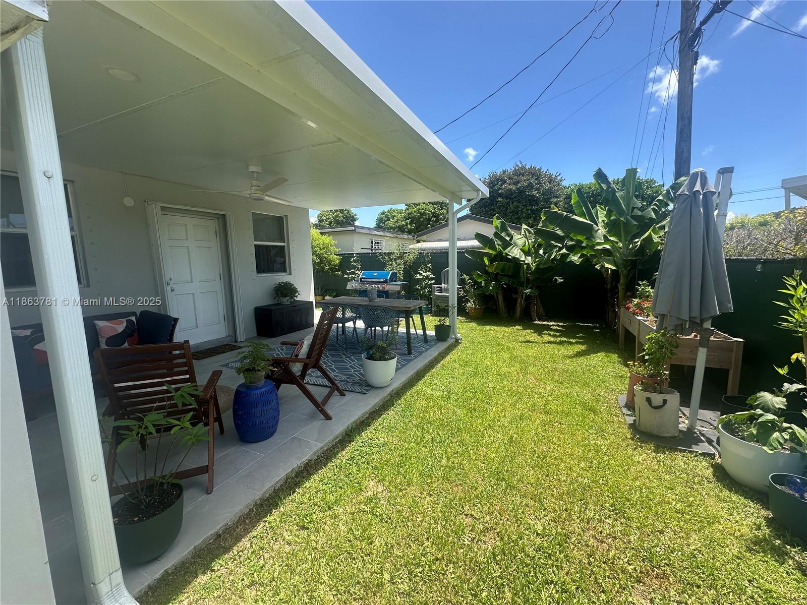 7310 Southwest 31st Street Miami, FL 33155 - Photo 18 of 25 a swimming pool with outdoor seating and plants