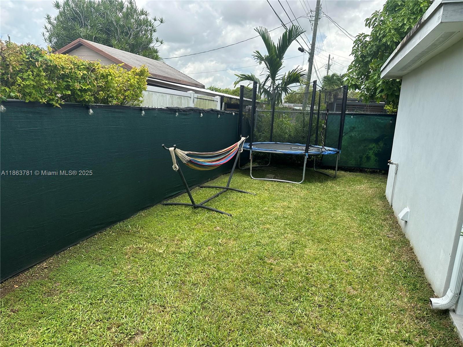 7310 Southwest 31st Street Miami, FL 33155 - Photo 19 of 25 a view of a bench in the garden near a lake