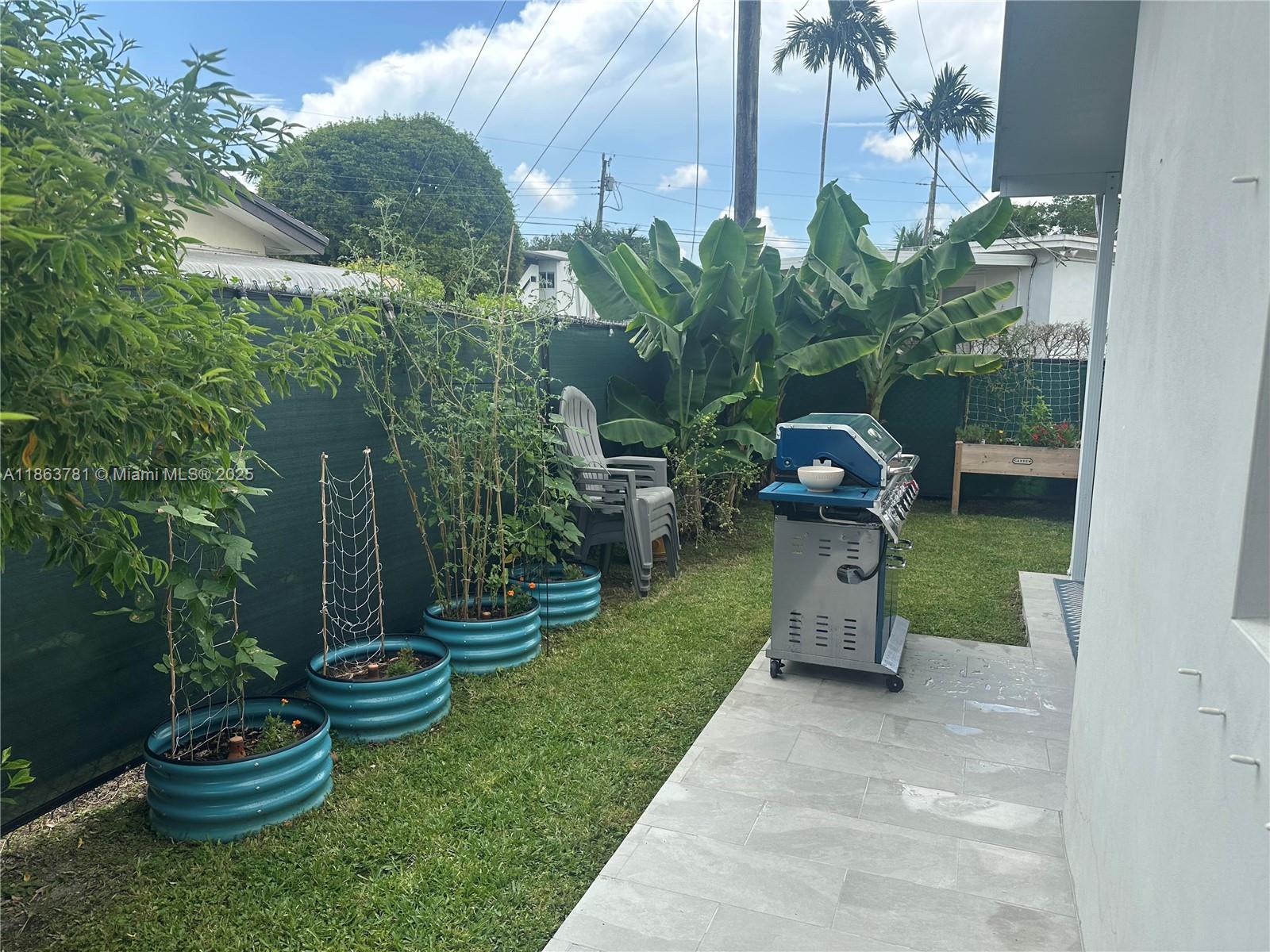 7310 Southwest 31st Street Miami, FL 33155 - Photo 23 of 25 a garden view with a seating space