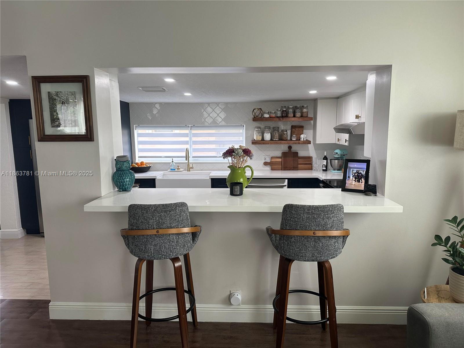 7310 Southwest 31st Street Miami, FL 33155 - Photo 6 of 25 a kitchen with a table chairs and wooden floor