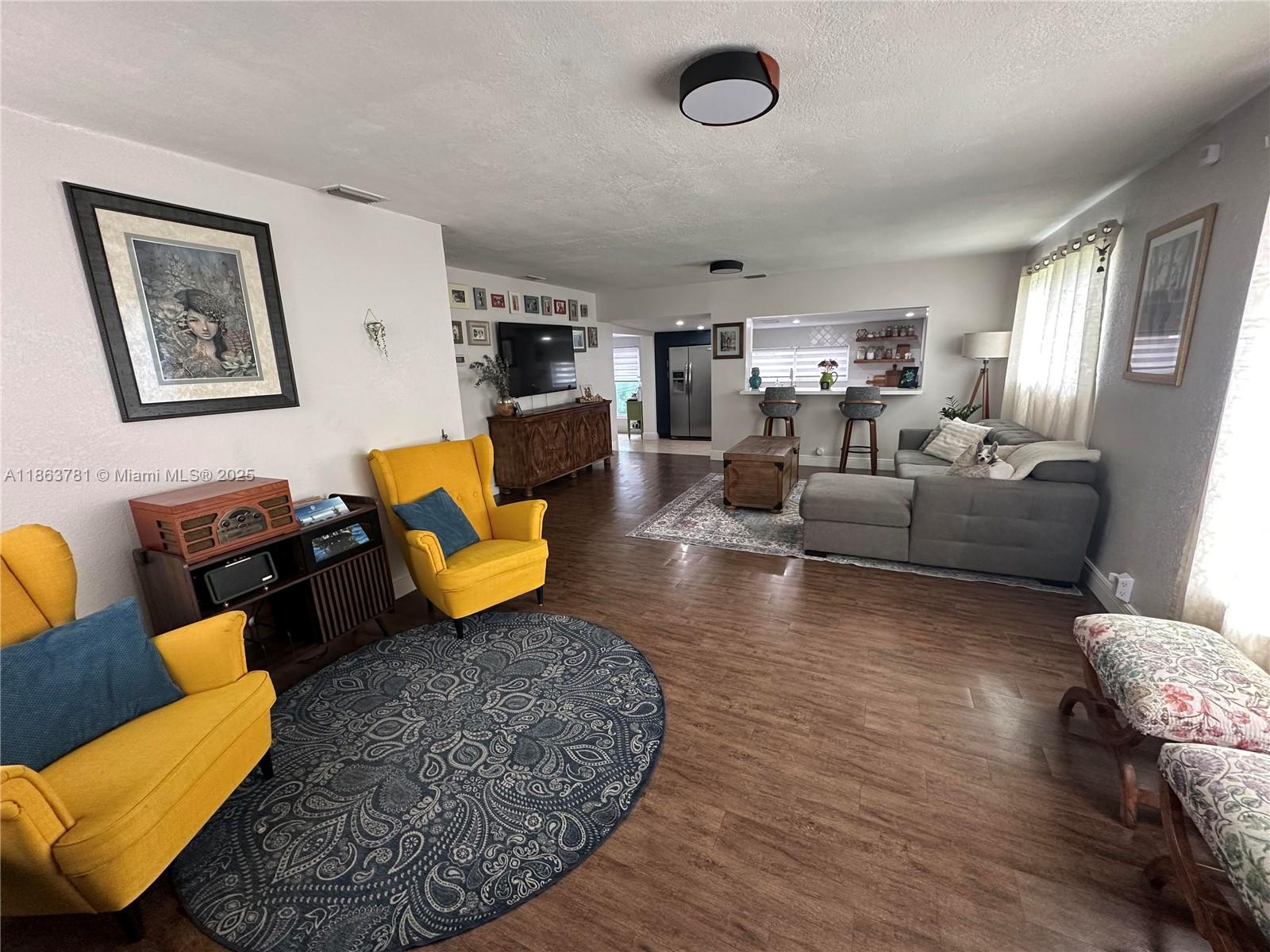 7310 Southwest 31st Street Miami, FL 33155 - Photo 7 of 25 a living room with furniture and wooden floor