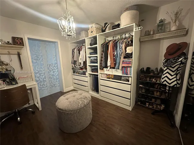 a view of a livingroom with furniture and staircase