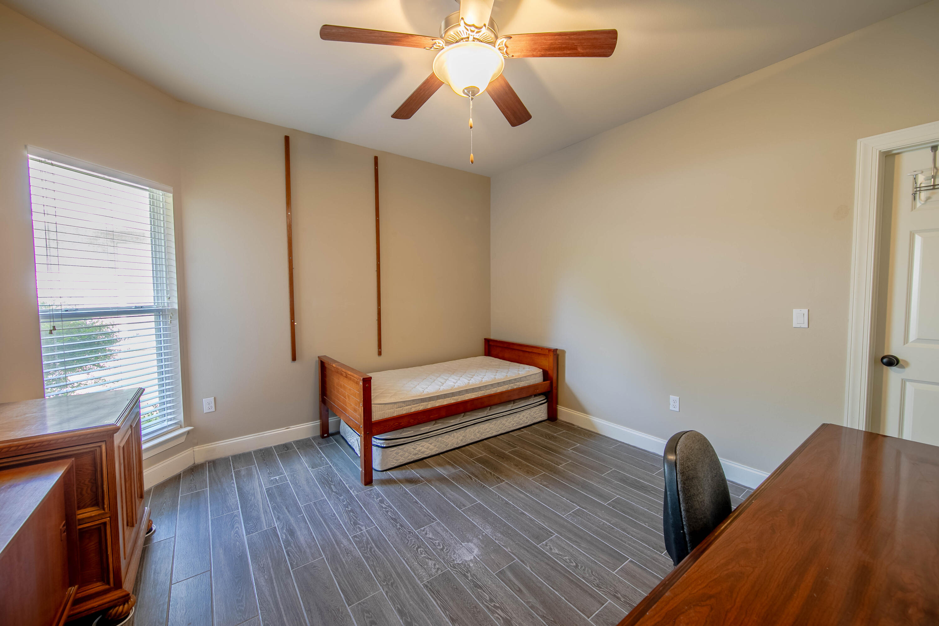 456 Windchime Way Freeport, FL 32439 - Photo 15 of 34 a view of room with window and wooden floor