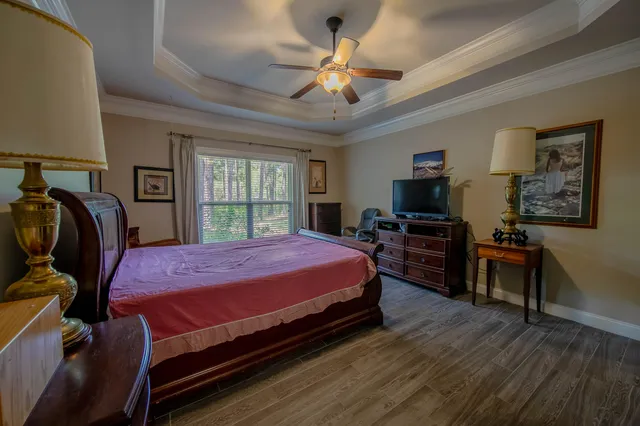 a bed room with a bed and dresser