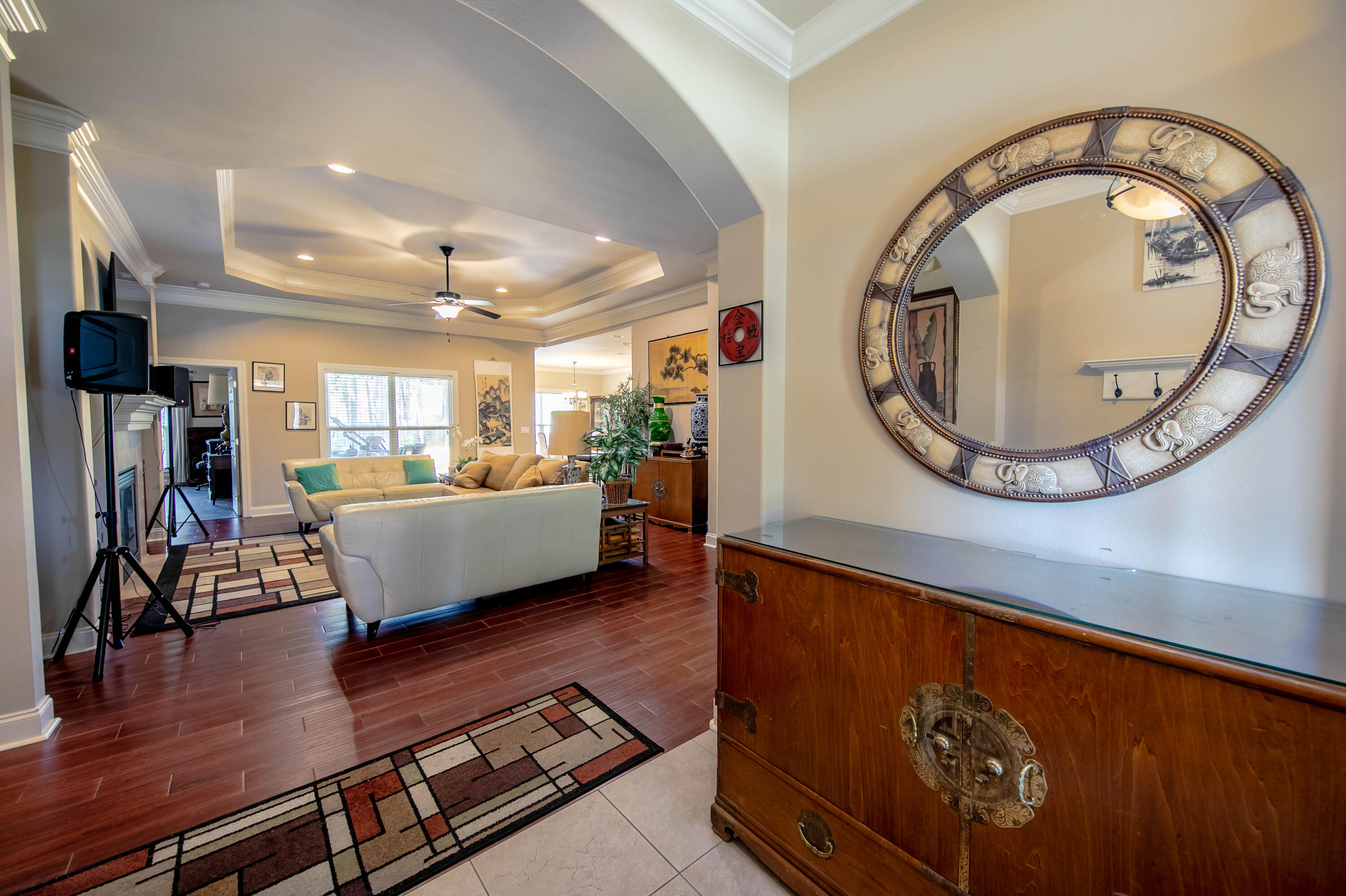 456 Windchime Way Freeport, FL 32439 - Photo 2 of 34 a living room with furniture a wooden floor and a large window
