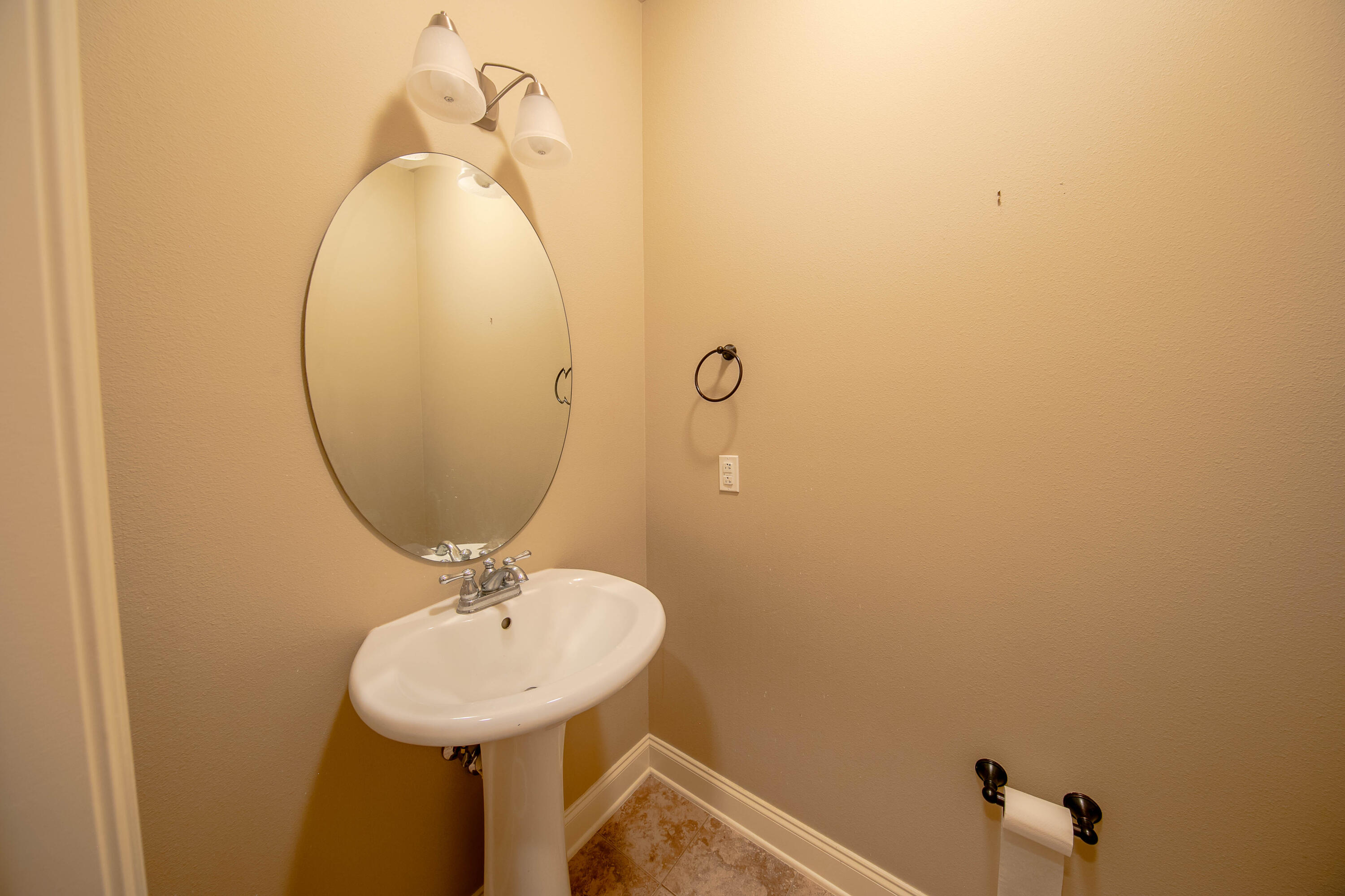 456 Windchime Way Freeport, FL 32439 - Photo 24 of 34 a bathroom with a sink and a mirror