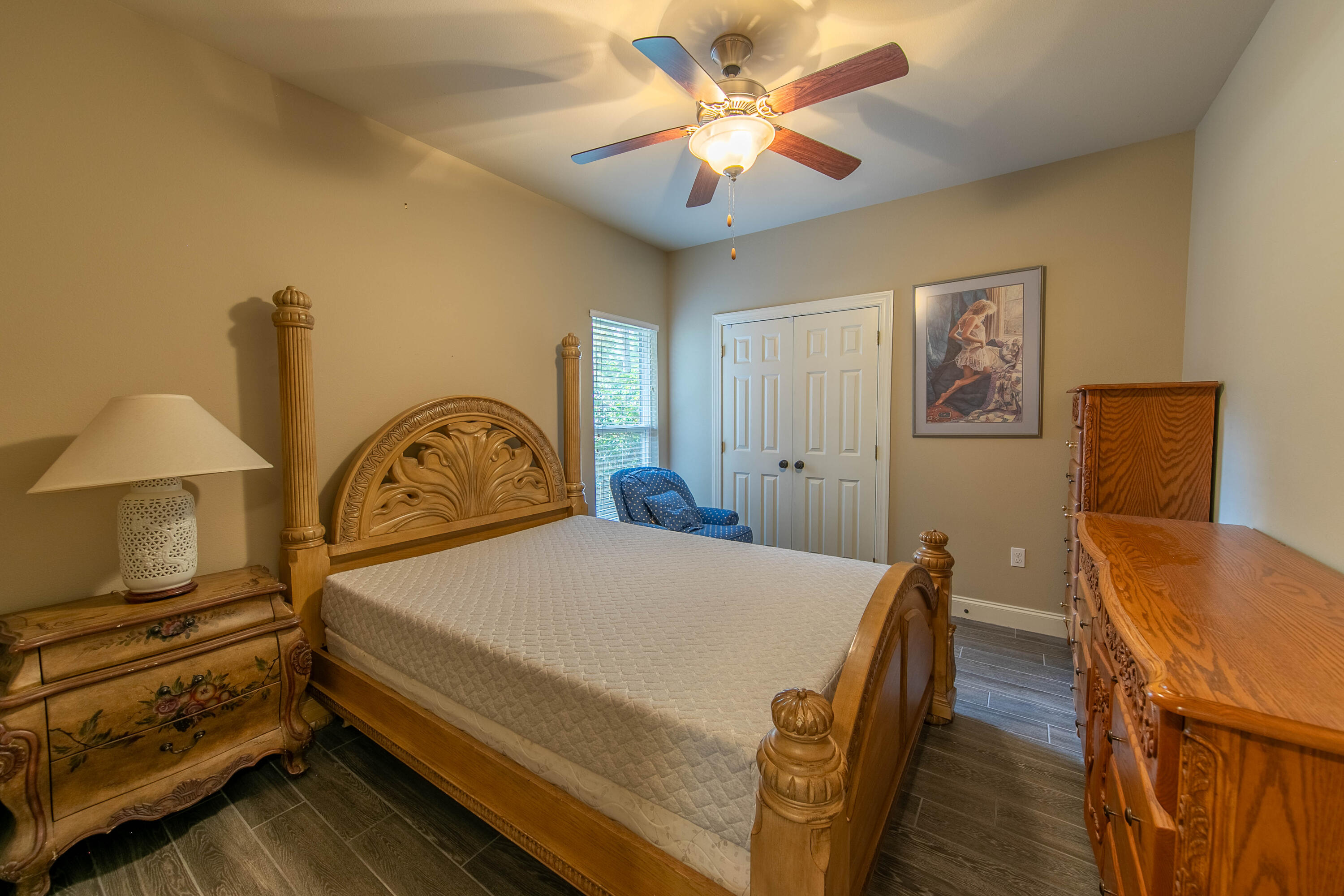 456 Windchime Way Freeport, FL 32439 - Photo 25 of 34 a bedroom with a bed and a chandelier