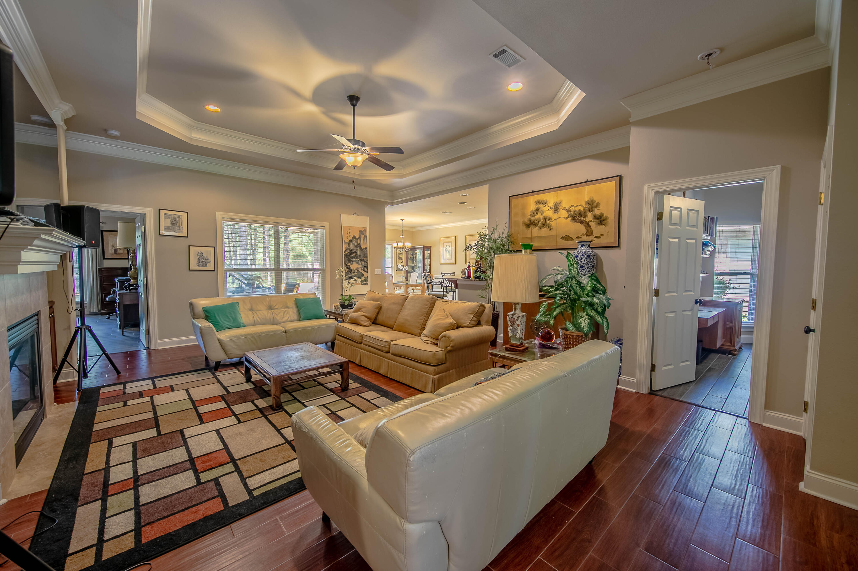 456 Windchime Way Freeport, FL 32439 - Photo 3 of 34 a living room with furniture and a flat screen tv