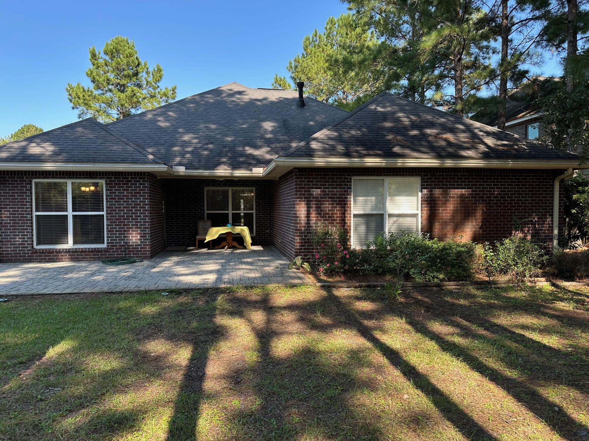 456 Windchime Way Freeport, FL 32439 - Photo 32 of 34 a front view of a house with a yard