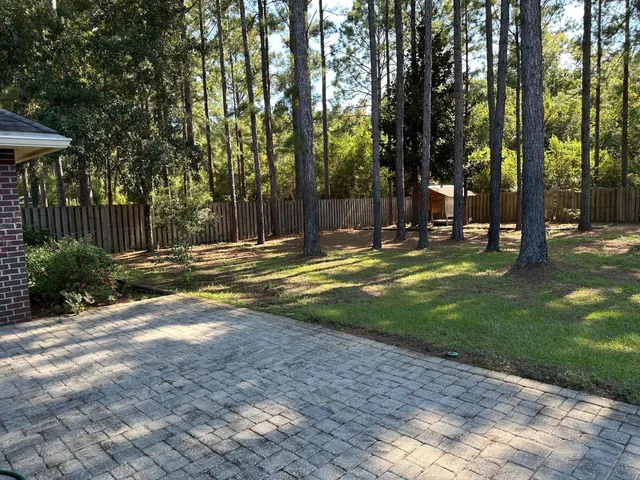 a view of a backyard with green space