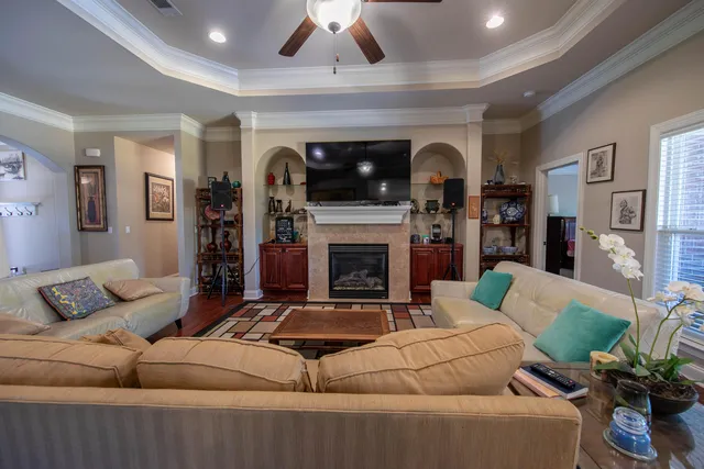 a living room with furniture and a fireplace