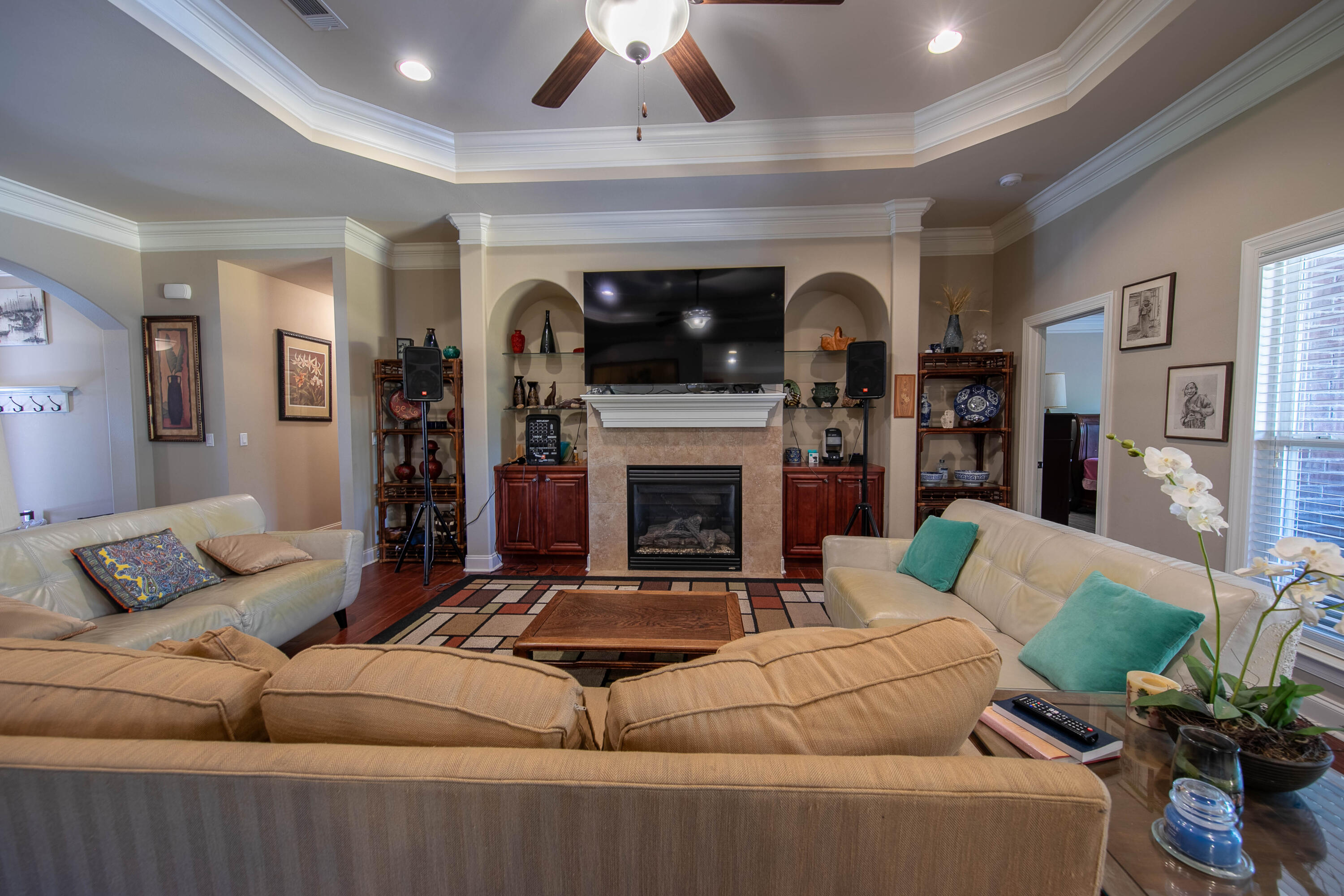 456 Windchime Way Freeport, FL 32439 - Photo 5 of 34 a living room with furniture and a fireplace