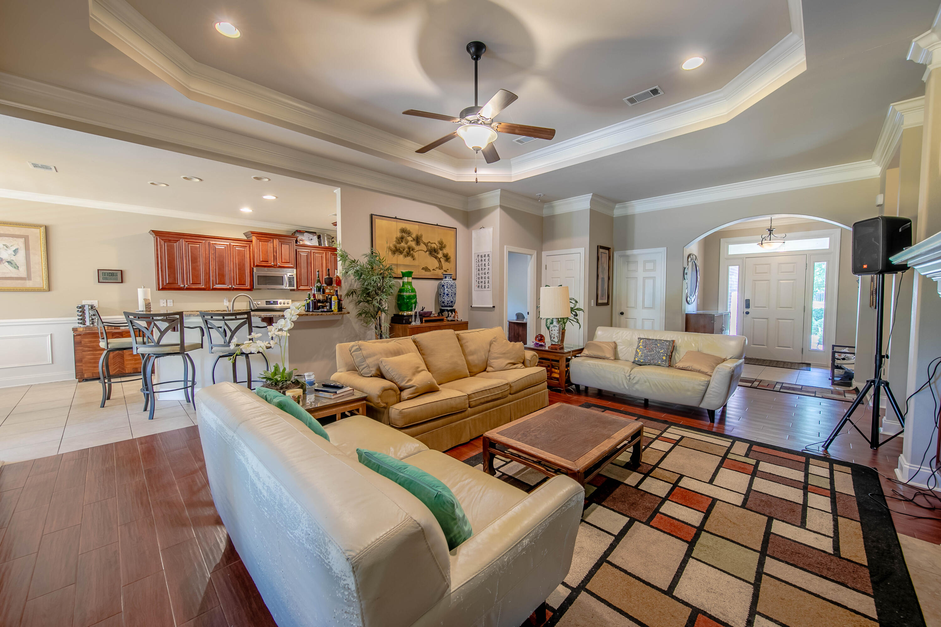 456 Windchime Way Freeport, FL 32439 - Photo 6 of 34 a living room with furniture and a chandelier