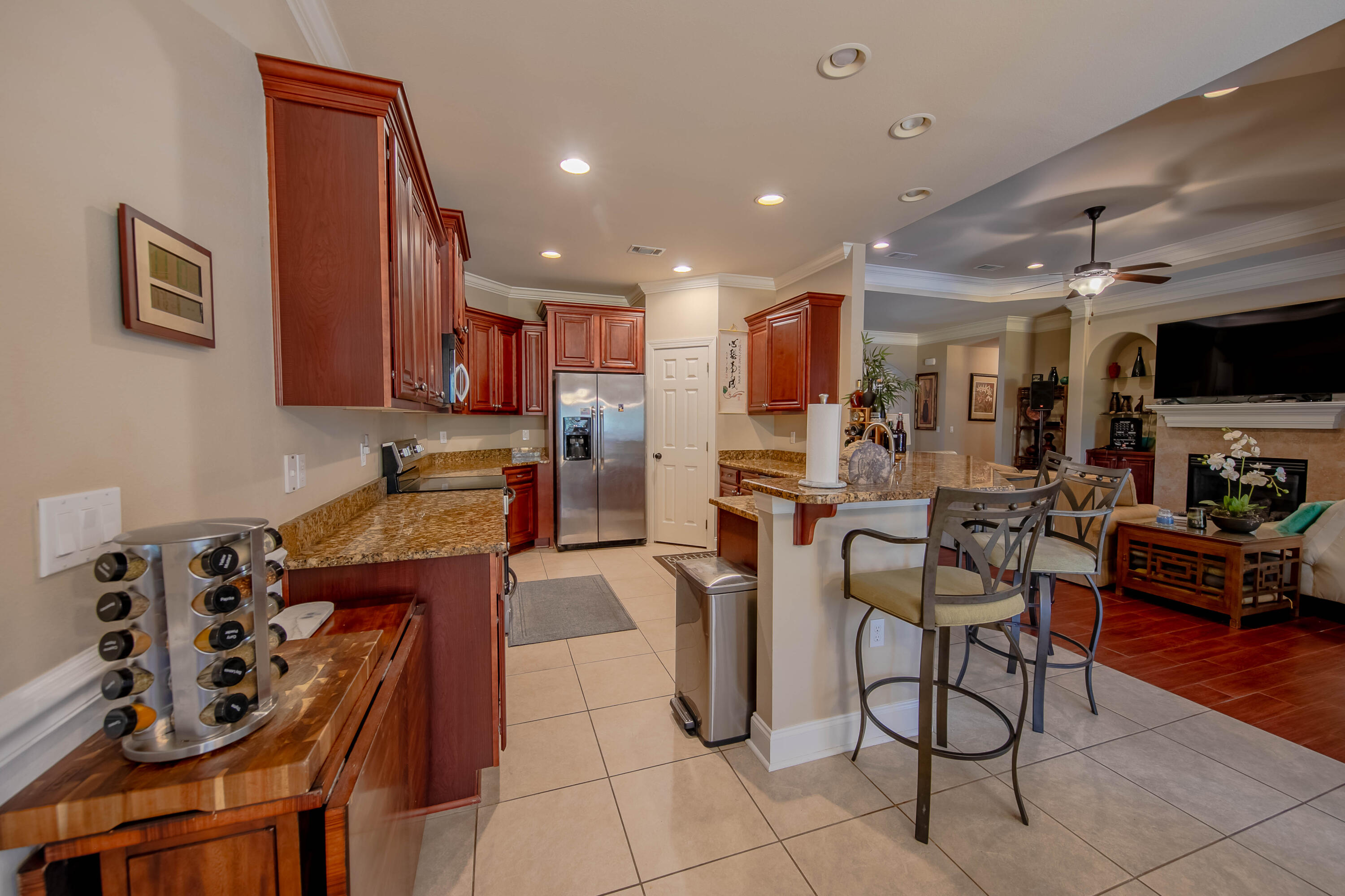 456 Windchime Way Freeport, FL 32439 - Photo 10 of 34 a view of kitchen with stainless steel appliances granite countertop a stove a sink a dining table and chair