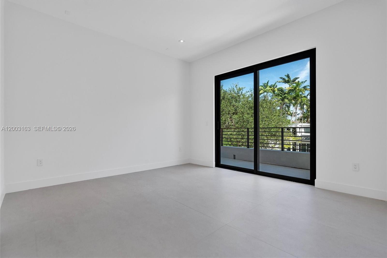 760 Woodcrest Road Key Biscayne, FL 33149 - Photo 15 of 43 a view of an empty room with a window