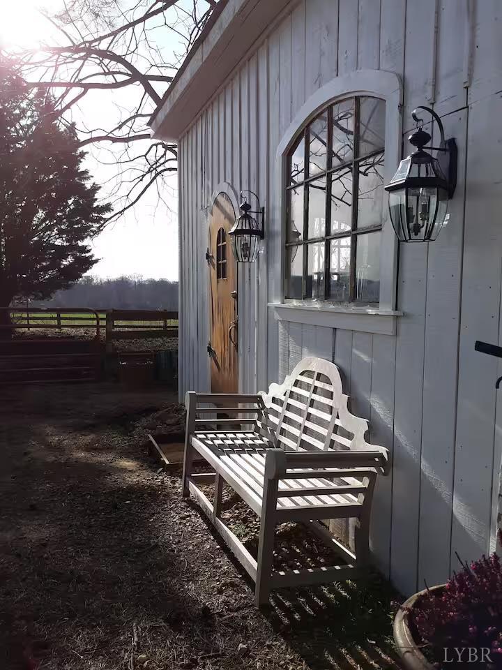 2416 Lowesville Road Amherst, VA 24521 - Photo 17 of 98 a view of a chairs and table in the back yard of the house
