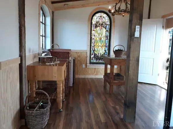 a room with stainless steel appliances kitchen island granite countertop furniture and a shower