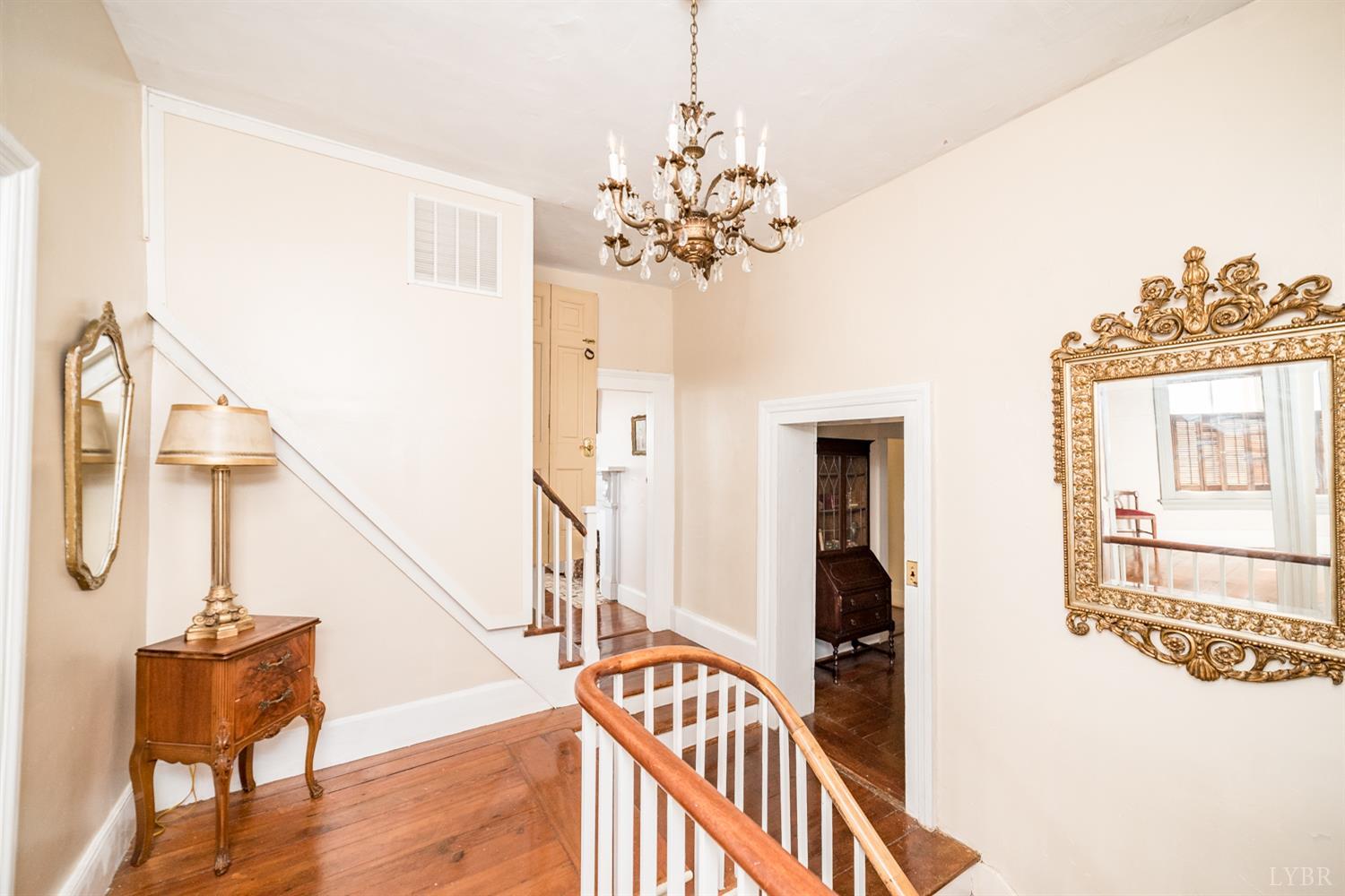 2416 Lowesville Road Amherst, VA 24521 - Photo 3 of 98 a view of a hallway with wooden floor and staircase