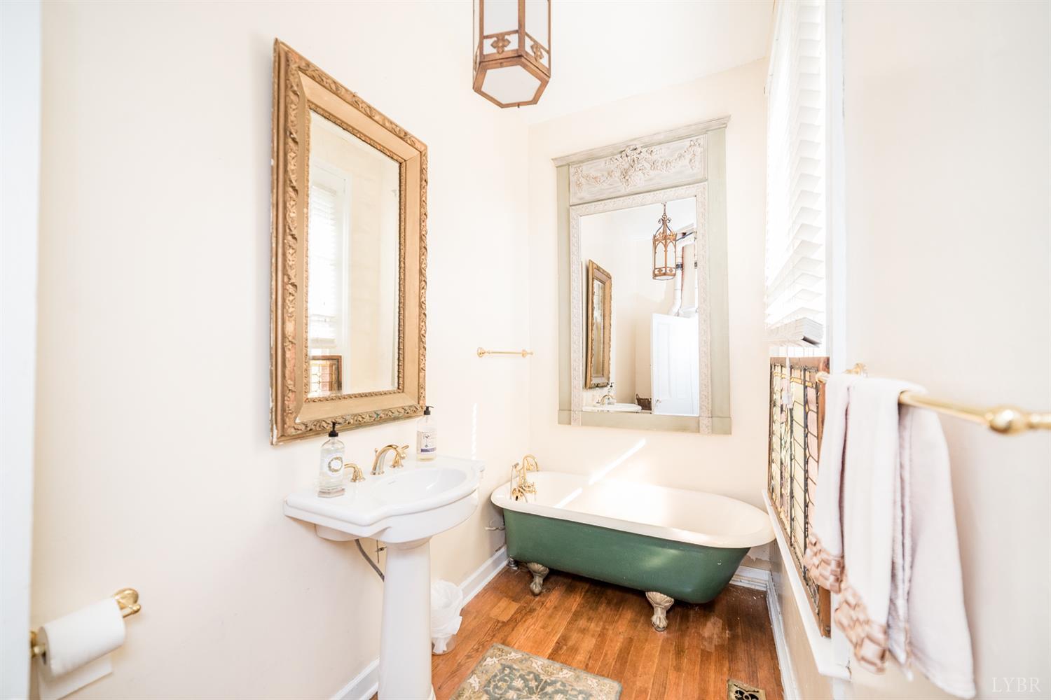 2416 Lowesville Road Amherst, VA 24521 - Photo 45 of 98 a bathroom with a sink mirror and a bathtub