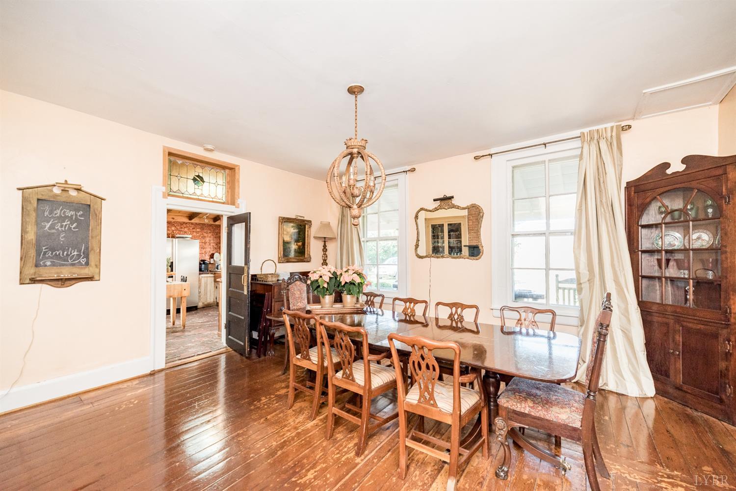 2416 Lowesville Road Amherst, VA 24521 - Photo 64 of 98 a living room with lots of furniture and wooden floor