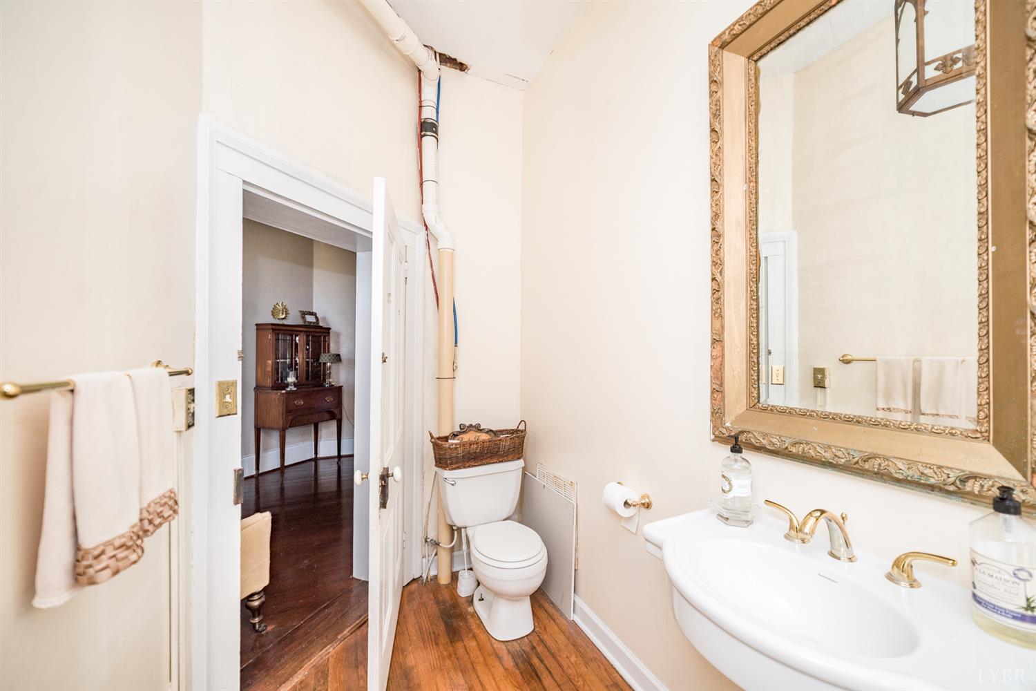 2416 Lowesville Road Amherst, VA 24521 - Photo 71 of 98 a bathroom with a granite countertop sink toilet and shower