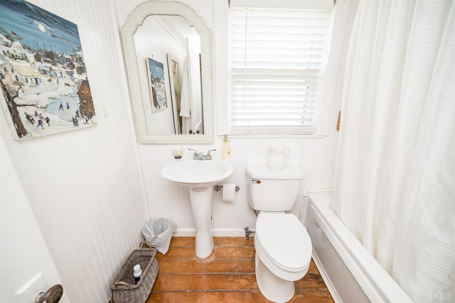 2416 Lowesville Road Amherst, VA 24521 - Photo 89 of 98 a bathroom with a toilet sink and mirror