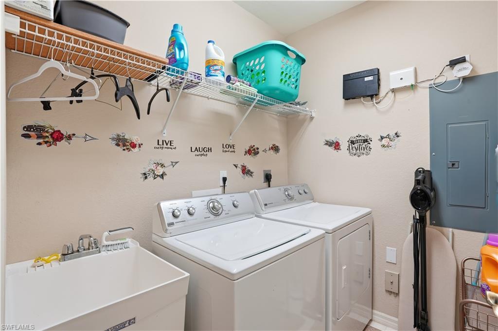 10871 Crooked River Road, Unit 202 Estero, FL 34135 - Photo 31 of 46 a utility room with dryer and washer