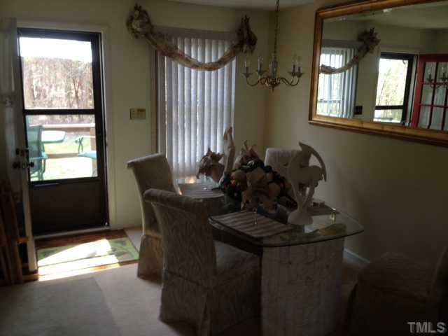 4220 Labrador Drive Raleigh, NC 27616 - Photo 7 of 15 a dining room with furniture and window