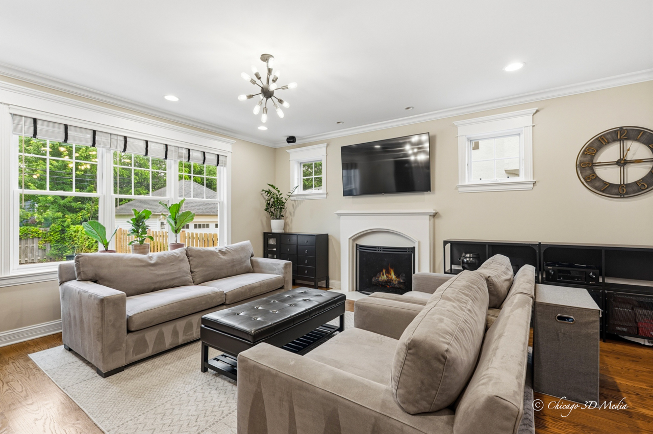306 17th Street Wilmette, IL 60091 - Photo 7 of 48 a living room with furniture a large window and a fireplace