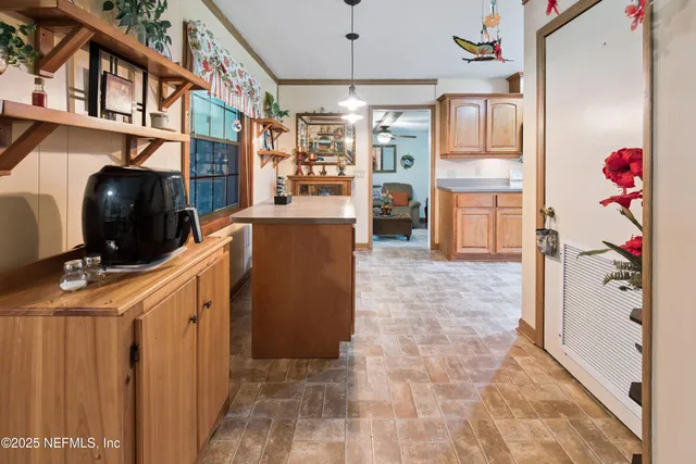 a kitchen with refrigerator and cabinets